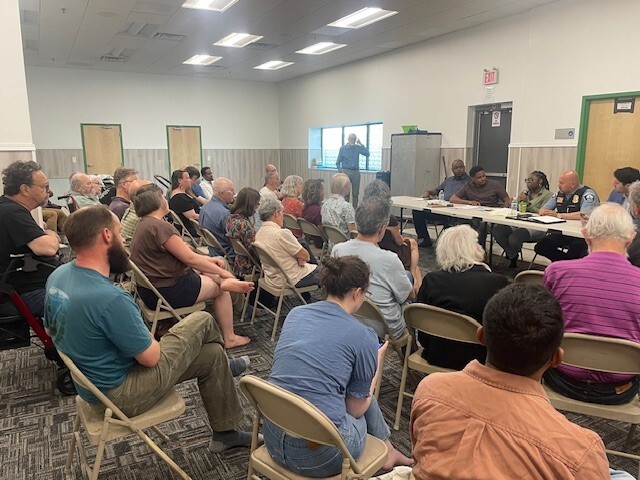 CM Wonsley alongside CM Osman, Inspector Gomez, CPS Shun Tillman, and OCS Deputy Director Jeffries at West Seward Block Clubs meeting