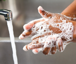 hand washing over sink
