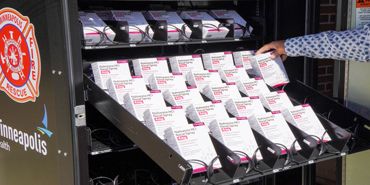 Minneapolis installed its first northside NARCAN vending machine. Pictured, the vending machine is getting filled with NARCAN boxes.