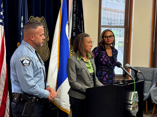 Bureau Chief Ayodele Famudo (center) answers a reporter's question during a May 19 press conference.