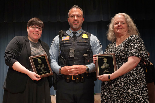 911 Dispatchers Katrina Neff and Lori Patrick receive their Civilian's Department Award of Merit plaques from MPD Chief Brian O'Hara.