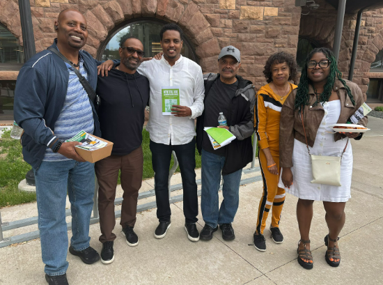 Council Member Wonsley stands with current and former Glendale residents and Council Member Jamal Osman. 