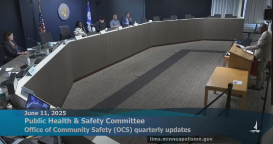 Commissioner Barnette speaks at the podium at the June 11 Public Health & Safety Committee meeting.