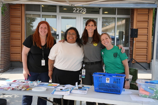 Service providers and city staff pose for a picture at the Lake Street Open House event on June 10.