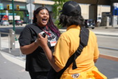 A LEAD Minneapolis staff member connects with a community member at the Lake Street Safety Center Open House.