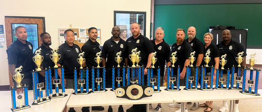 MPD K9 unit posing with their trophies from the annual United States Police Canine Patrol Dog Field Trials in Winona