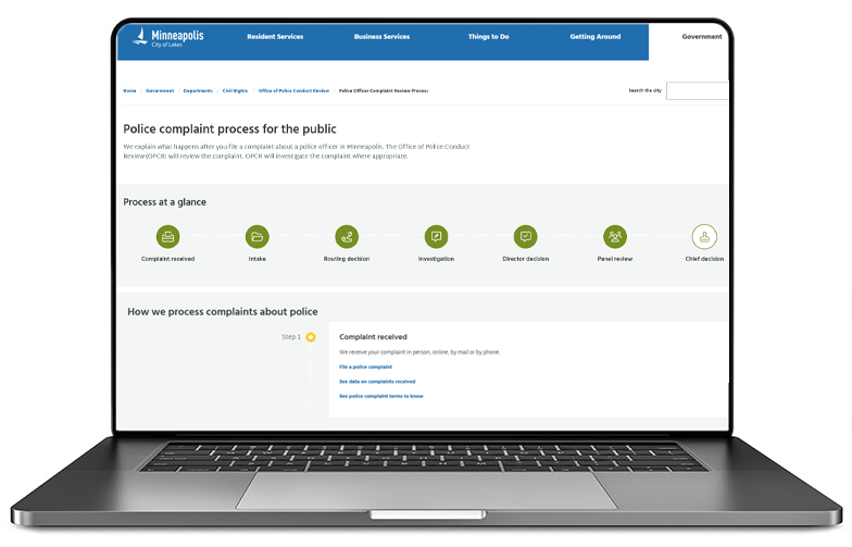 Image of laptop with the police complain process for the public webpage on the screen