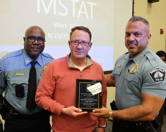 Crime Prevention Specialist Shannon McDonough (center) was awarded for building strong community ties.