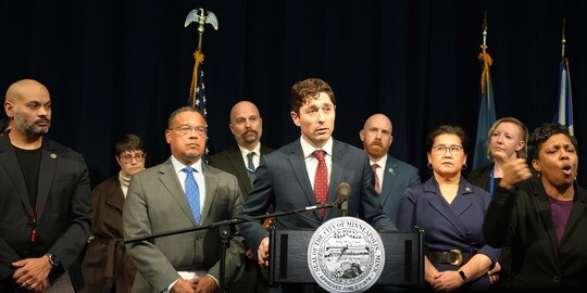 Elected Officials at news conference announcing lawsuit