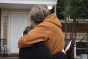 Two people hugging