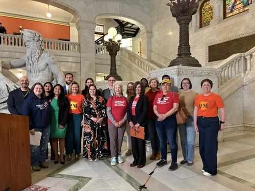 Council Members, families and advocates celebrating the passage of the firearms regulation ordinance. 