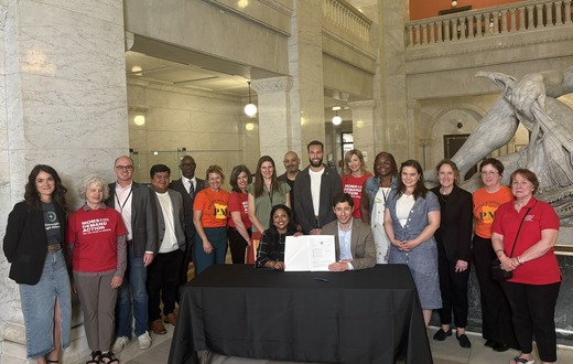 Council Members and Mayor Frey at a document signing with Moms Demand Action and Protect MN advocates.