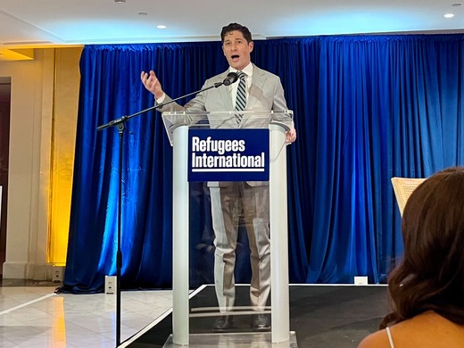 Mayor Jacob Frey speaks at a podium at the Refugees International Advocacy Awards ceremony.