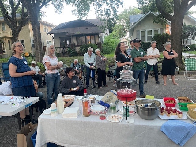 Neighbors in Seward do a round of introductions during a National Night Out block party in Ward 2. 