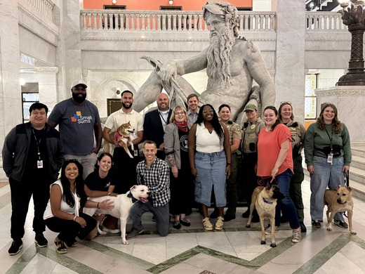 CM Wonsley with co-authors; Animal Care & Control leadership, community advocates, dogs celebrating the Bark Down Barriers Ordinance. 