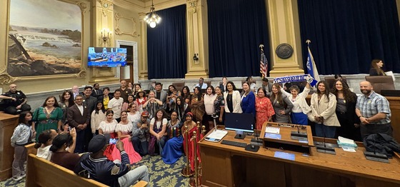 Large group of people pose for photo with Council Member Jason Chavez in City Council Chambers to honor 2026 Latino Heritage Month