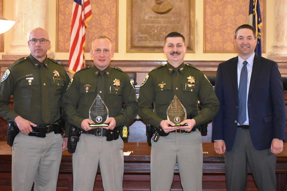 (Left to right) MHP Colonel Kurt Sager, Sergeant Barry Kilpela, Trooper Justin Knapp, Attorney General Knudsen