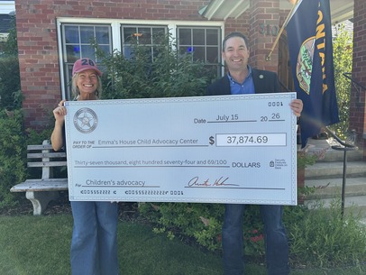 Attorney General Knudsen with check granted to Emma's House
