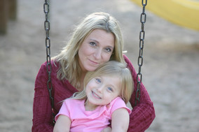 Mom and child on a swing.