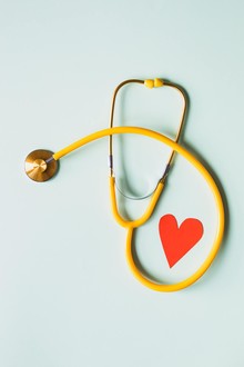 Stethoscope and a cut out heart picture