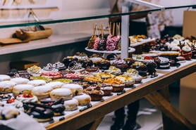 buffet table filled with dessert 