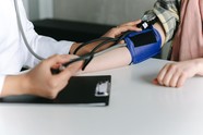 Image of an arm with blood pressure being taken