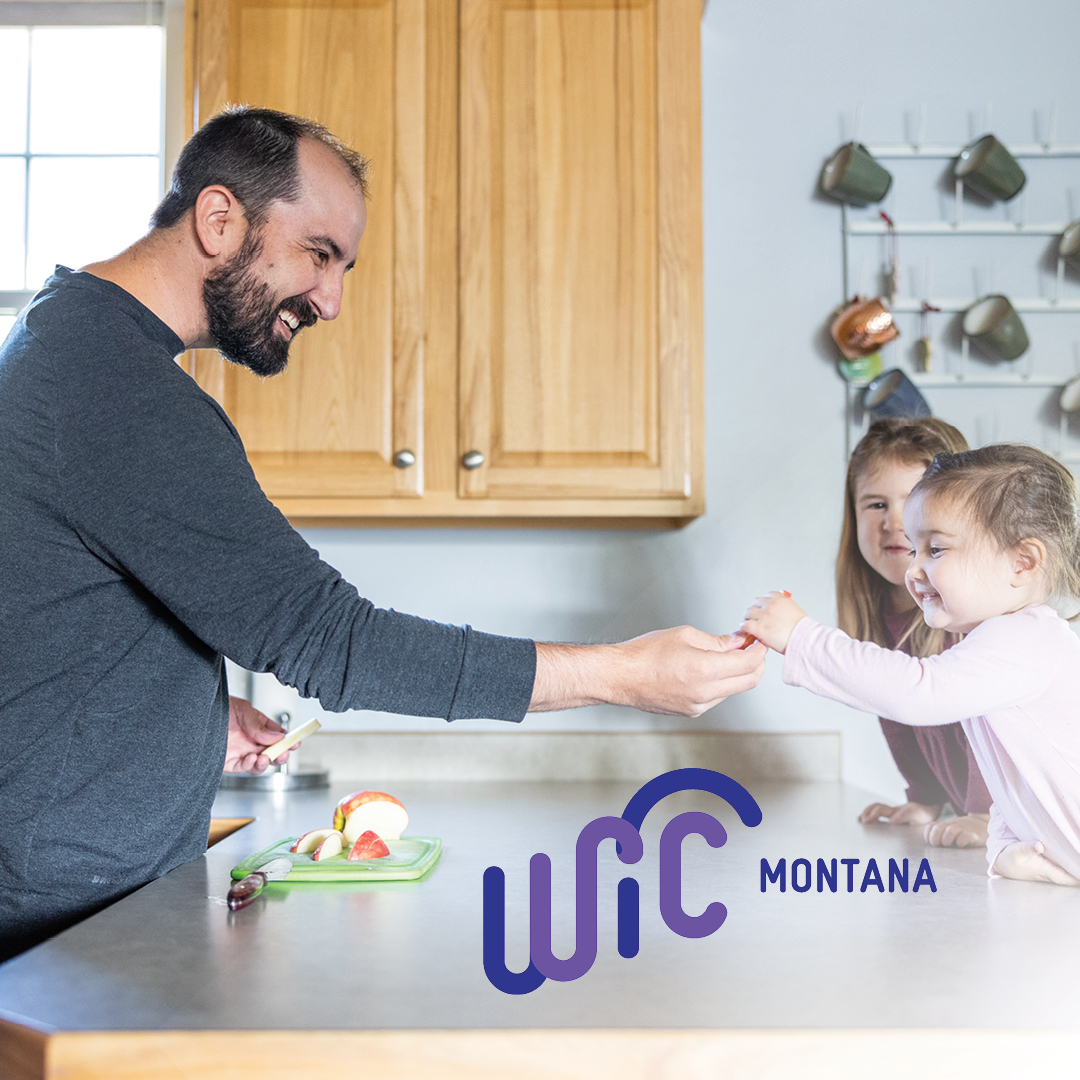 Dad sharing a healthy snack with his children