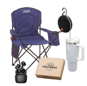 blue camping chair, light blue Stanley bottle, black wireless ear buds, black JBL bluetooth speakers, CraveBox of snacks
