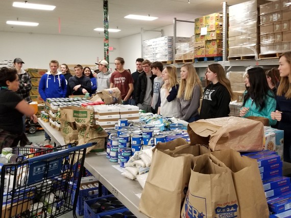 Students packing food in bags