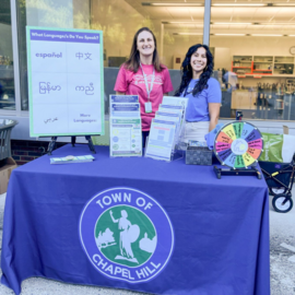 Rebecca Buzzard and Katelyn Robalino tabling at Family Fun Friday at the library
