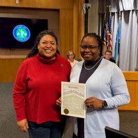 Council Member Berry presenting Dare to Share proclamation to OWASA