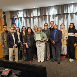 Council members with staff members receiving Black History Month proclamation