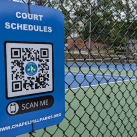 Court schedule QR code on fence at Hargraves tennis courts