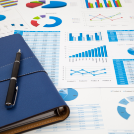 notebook with pen and financial documents