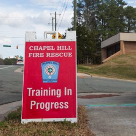 A-frame in front of fire station that says Chapel Hill Fire Rescue Training in Progress
