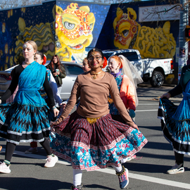 People in dresses in holiday parade