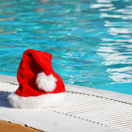 Santa hat next to swimming pool