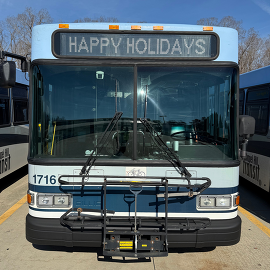 Chapel Hill Transit bus that has Happy Holidays on marquis