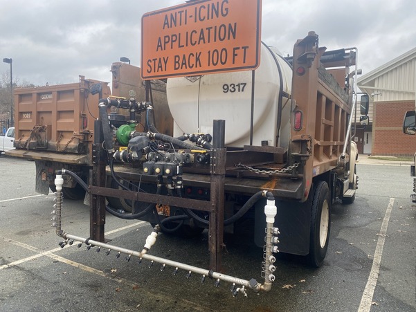Public Works vehicle with container on back to spray brine