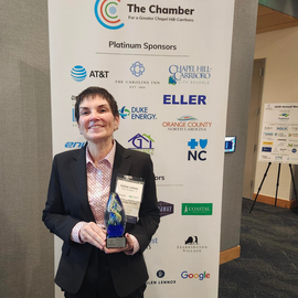Police Chief Celisa Lehew holding award from Chamber for a Greater Chapel Hill-Carrboro