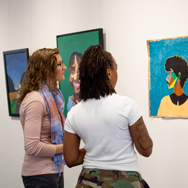 People viewing artwork in a public space