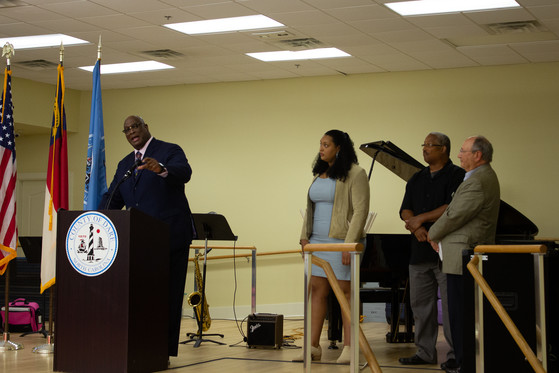 Ms. Tillett’s two sons, Johnny Tillett and Michael Tillett, as well as her granddaughter, Maya Tillett give remarks on stage.