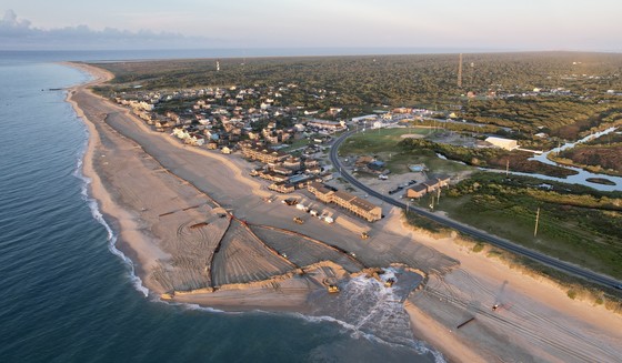 Aerial image of Buxton beach nourishment with the Cape Hatteras lighthouse in the background.
