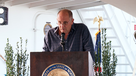 Image of Commissioner Jim Tobin speaking during the christening event in Wanchese Marine Industrial Park.