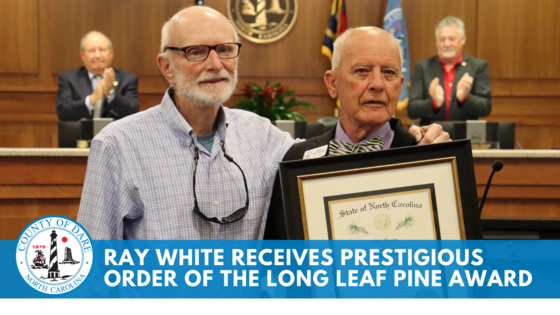 Image of Ray White standing with Chairman Woodard, holding a certificate. Text reads: Ray White Receives Prestigious Order of the Long Leaf Pine Award