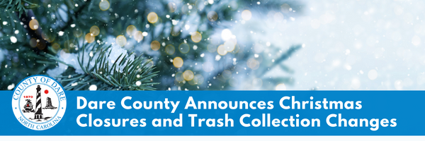 Image of a snowy spruce tree. Text overlay reads, "Dare County Announces Christmas Closures and Trash Collection Changes"