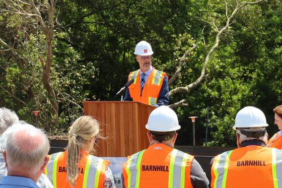 Image of Mayor Ben Sproul standing at a podium speaking to the crowd.