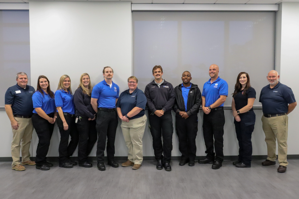 Group photo of the professors and graduates.