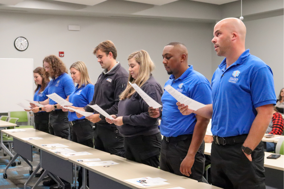 Image of the graduates reciting their oath.