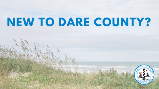 Heading: New to Dare County? (text over an image of a dune line and ocean)